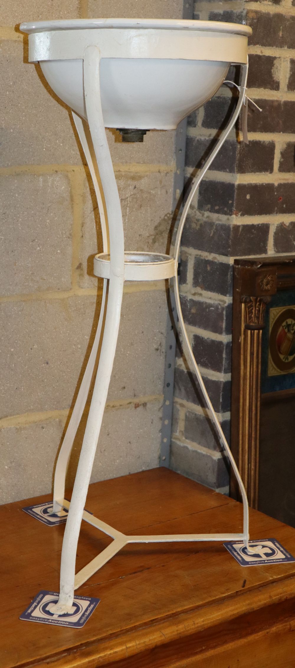 A painted wrought iron wash stand, H.84cm